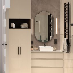 Design With Love - Nowoczesna łazienka z beżowymi szafkami, owalnym lustrem z podświetleniem LED, białym umywalką nablatową i czarnym grzejnikiem drabinkowym z ręcznikiem.