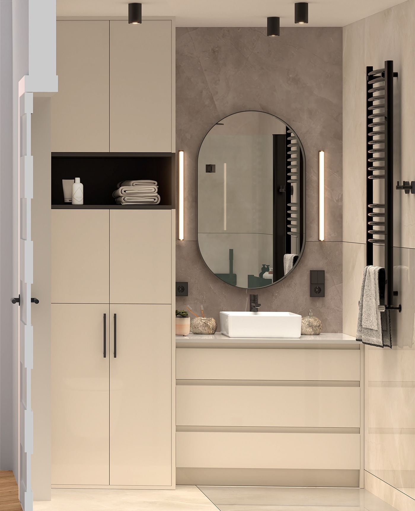 Nowoczesna łazienka z beżowymi szafkami, owalnym lustrem z podświetleniem LED, białym umywalką nablatową i czarnym grzejnikiem drabinkowym z ręcznikiem.