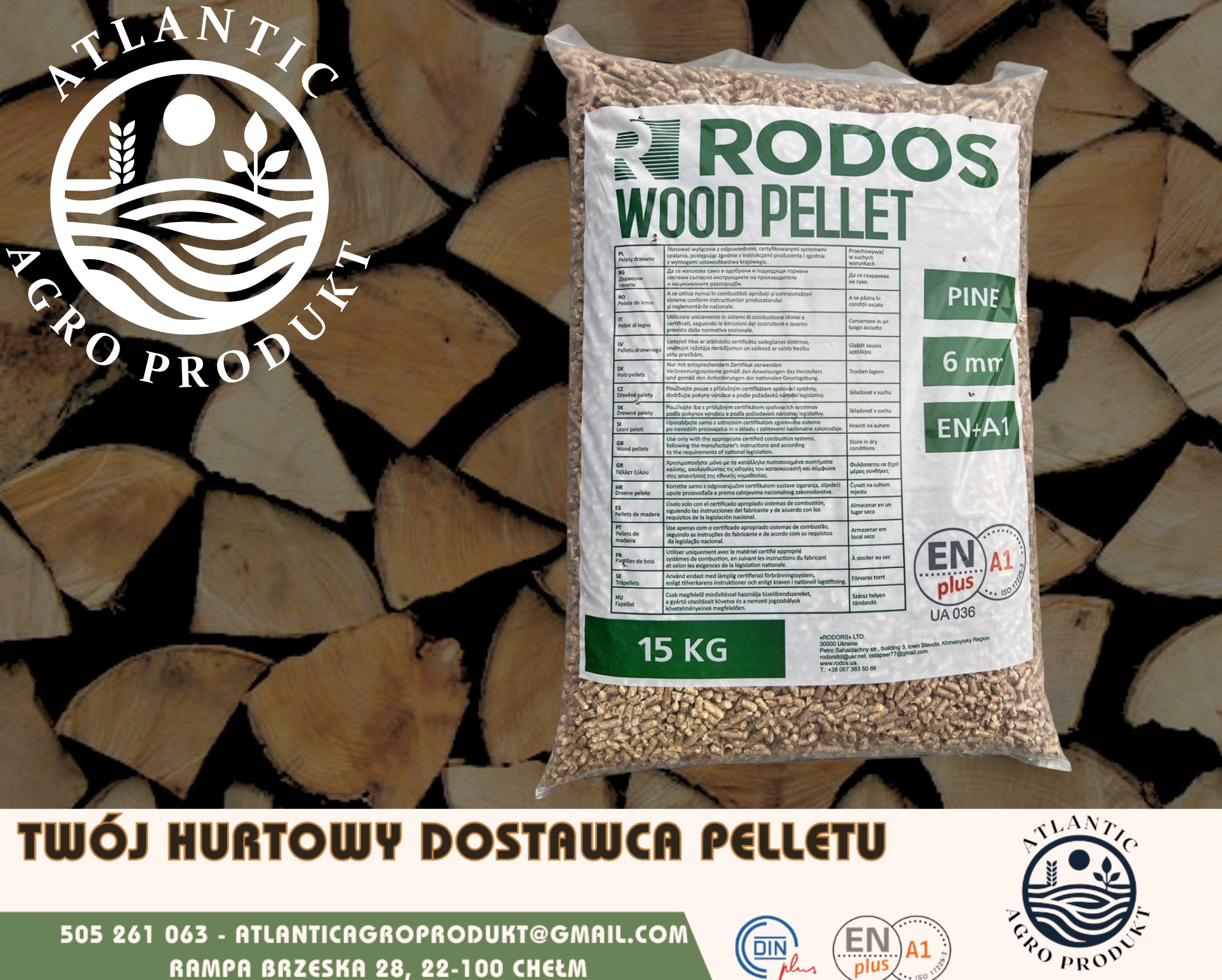 Worek pelletu drzewnego Rodos Wood Pellet 15 kg na tle drewna. Widoczne oznaczenia jakości ENplus A1 i DINplus. Informacja o dostawcy: Atlantic Agro Produkt.