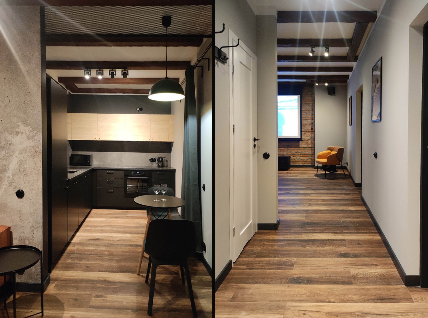 Nowoczesne wnętrze: kuchnia z ciemnymi szafkami i drewnianymi blatami, połączona z korytarzem z drewnianą podłogą i widokiem na salon z ceglaną ścianą.