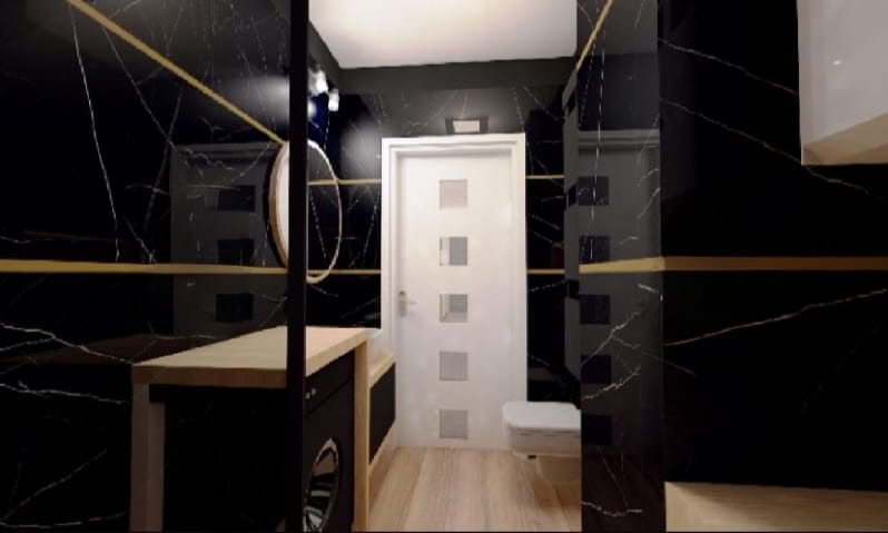 Elegancka łazienka w Lublińcu z czarnymi płytkami imitującymi marmur, złotymi akcentami i drewnianymi elementami. Nowoczesny design z okrągłym lustrem i minimalistyczną armaturą.
