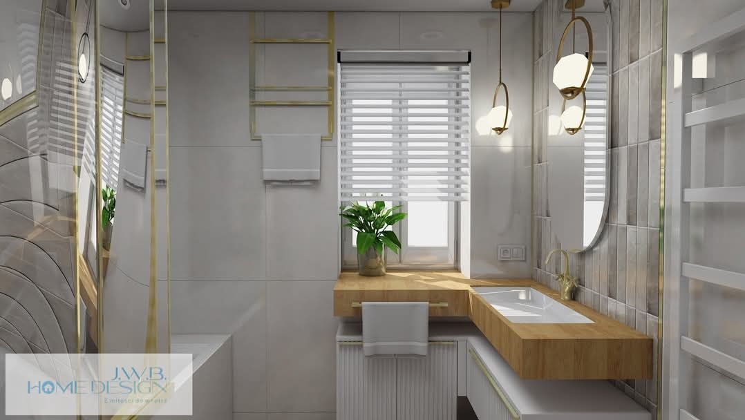 Nowoczesna łazienka z drewnianym blatem, okrągłym lustrem i wiszącymi lampami. Minimalistyczny design z akcentami złota i rośliną w doniczce na parapecie.