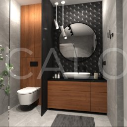 Calo Partners - Nowoczesna łazienka z drewnianą szafką pod umywalką, okrągłym lustrem na tle czarnej, geometrycznej ściany. Minimalistyczne oświetlenie i szara, kamienna podłoga.