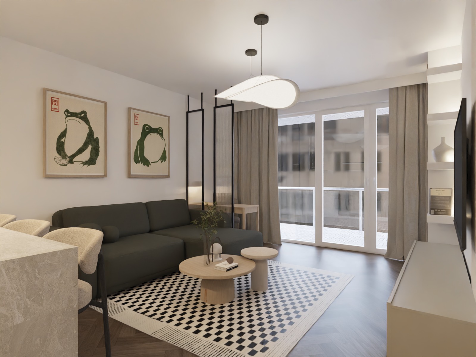 Nowoczesny salon z szarą sofą narożną, okrągłym stolikiem kawowym na wzorzystym dywanie i dekoracjami ściennymi z motywem żab. Jasne wnętrze z dużym oknem balkonowym.