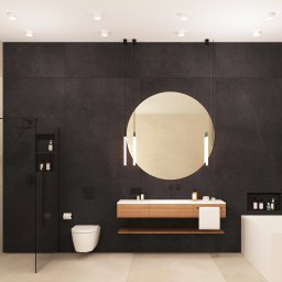 Ewa Stankiewicz EST Interior - Nowoczesna łazienka z czarną ścianą, okrągłym lustrem podświetlanym i minimalistyczną armaturą. Kabina prysznicowa ze szklaną ścianką i wnęka z kosmetykami.