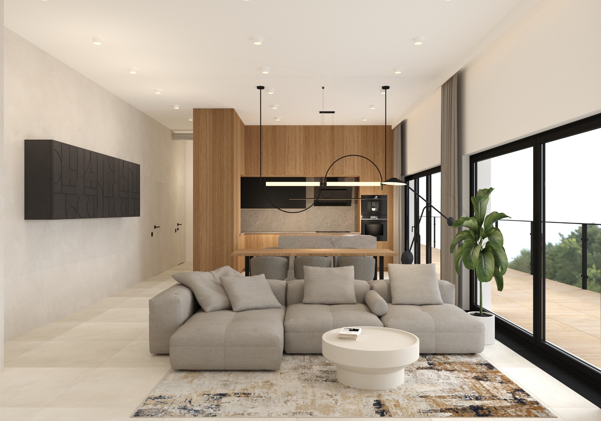 Jasne wnętrze: salon z szarą sofą i okrągłym stolikiem kawowym na wzorzystym dywanie. W tle drewniana zabudowa kuchenna z wyspą i czarnym oświetleniem.