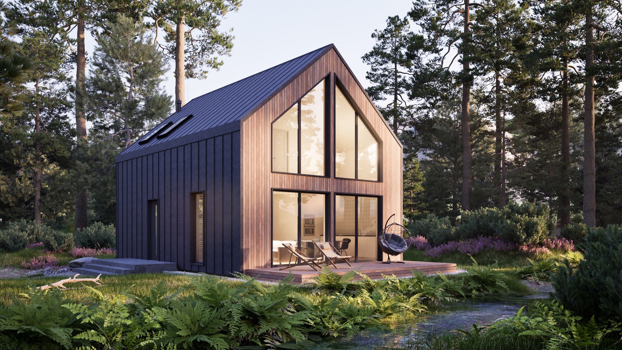 Nowoczesny dom z ciemną, pionową elewacją i dużymi oknami, otoczony zielenią. Taras z leżakami i wiszącym fotelem. Widok z poziomu gruntu,  w tle las.