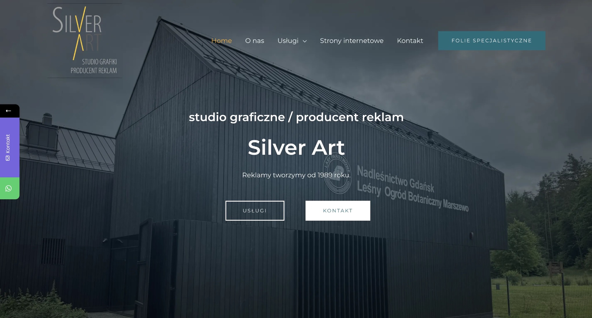 Strona internetowa studia graficznego Silver Art z widocznym budynkiem firmy w tle. Menu z zakładkami: Home, O nas, Usługi, Strony internetowe, Kontakt.