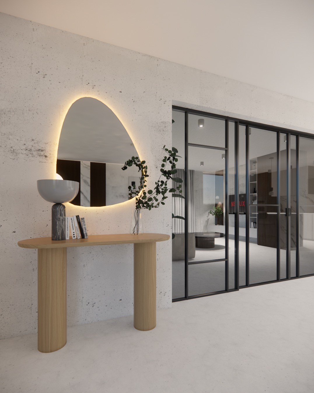 Nowoczesny hol: drewniana konsola z lampą i książkami, podświetlane lustro o nieregularnym kształcie, przeszklone drzwi przesuwne z czarną ramą.