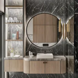 Nowoczesna łazienka z marmurową ścianą, okrągłym lustrem z podświetleniem LED, drewnianą szafką pod umywalką i półkami z kosmetykami, ukazująca elegancję projektu.