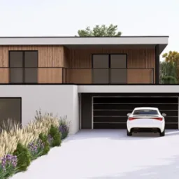 Nowoczesny dom z garażem i zagospodarowanym ogrodem w Krosno. Elewacja z elementami drewna, jasny podjazd, roślinność ozdobna wzdłuż ścieżki.