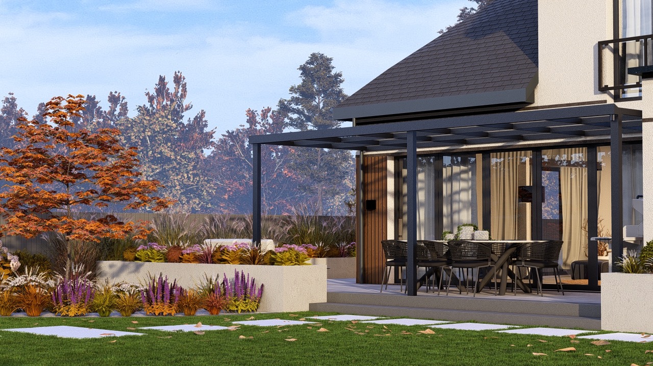 Nowoczesny ogród z pergolą i tarasem. Kwitnące rabaty, trawnik z płytami, drzewo o pomarańczowych liściach. Eleganckie meble ogrodowe na zewnątrz domu.