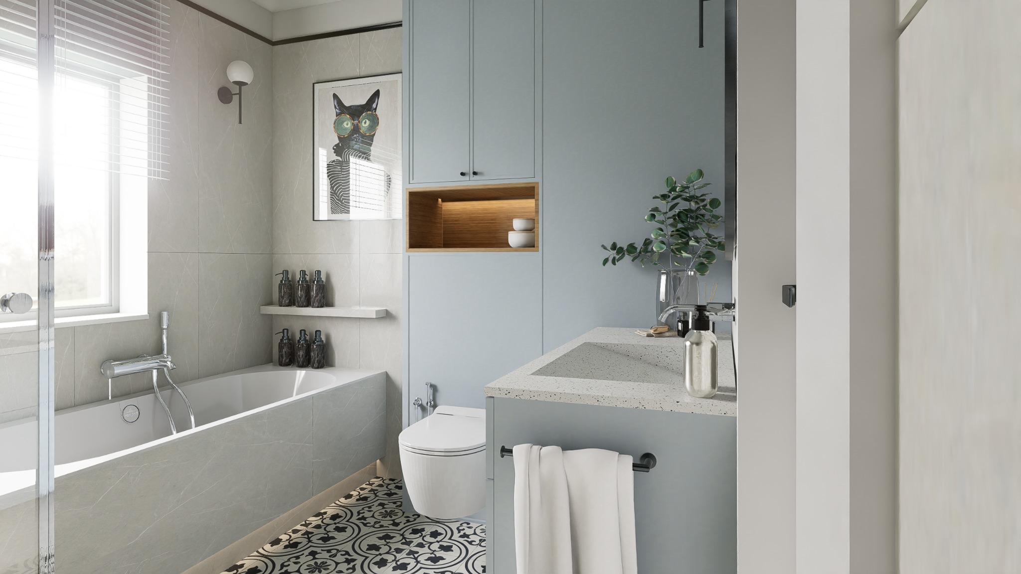 Jasna łazienka w szaro-błękitnych tonach z wanną, toaletą i umywalką. Na ścianie grafika kota w okularach. Na podłodze wzorzyste płytki. Nowoczesny design.