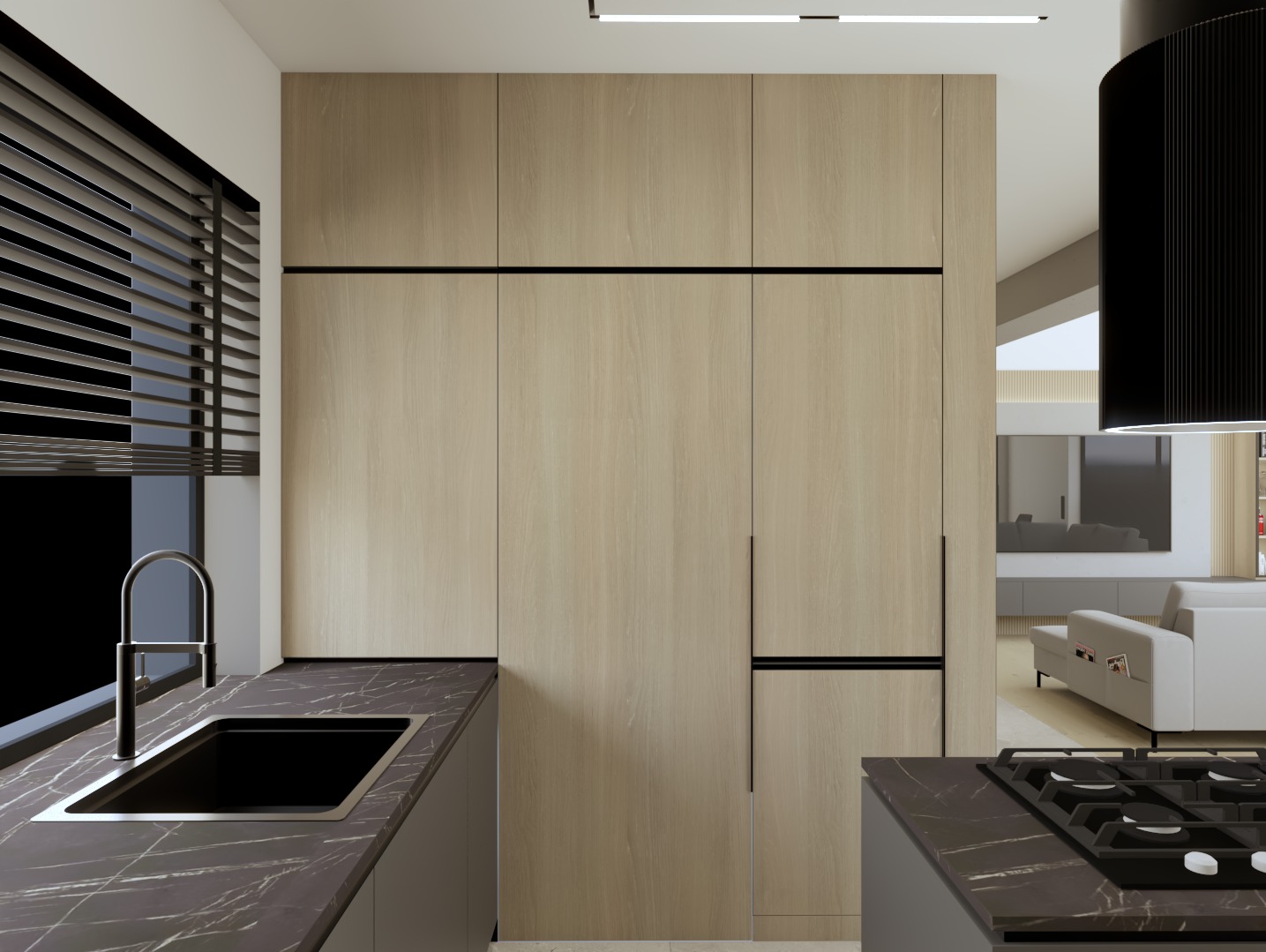 Minimalistyczna kuchnia: zabudowa z jasnego drewna z czarnymi akcentami, czarny blat z marmurkowym wzorem, widok na salon z sofą.