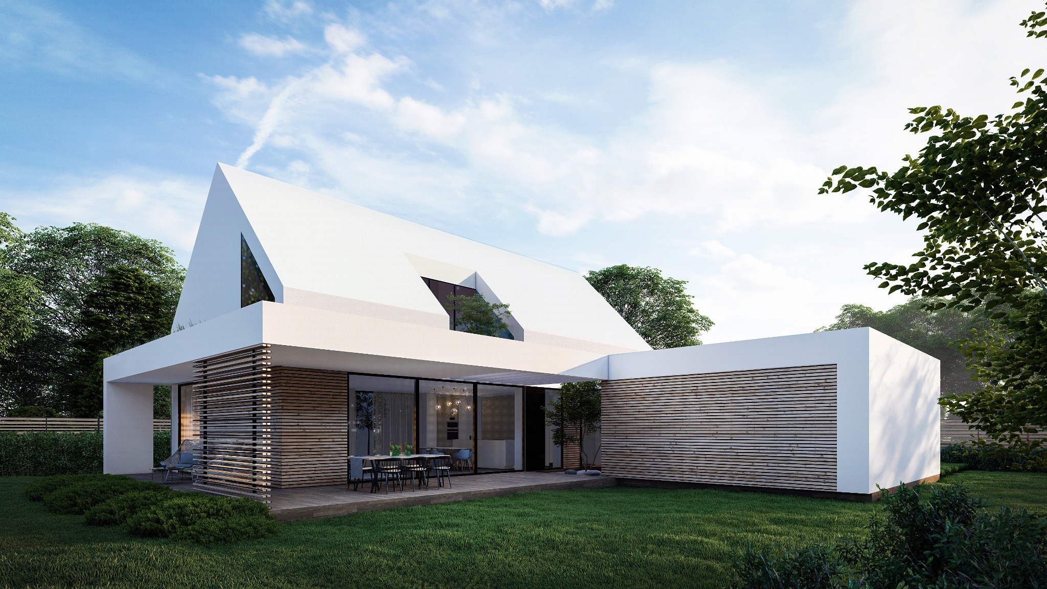 Nowoczesny dom jednorodzinny z białymi ścianami i drewnianymi panelami, otoczony zielenią. Widoczny taras z meblami ogrodowymi i charakterystyczny dach z oknem.