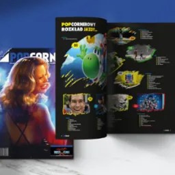 Okładka i rozkładówka magazynu POPCORNER z grafikami gier, seriali, filmów i komiksów, na marmurowym tle z niebieskim akcentem. Widoczny fragment twarzy kobiety.