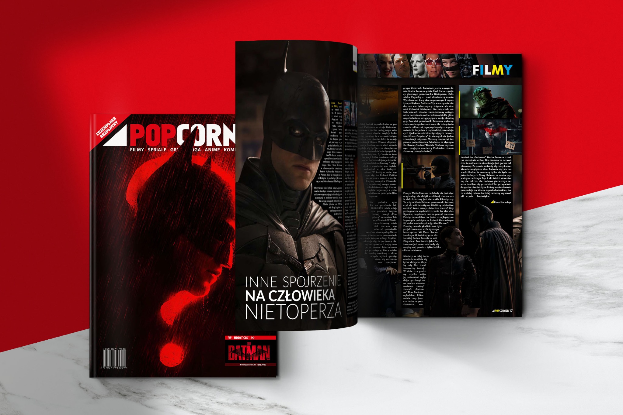 Rozkładówka magazynu POPCORNER z artykułem o filmie 'Batman'. Na stronie główne zdjęcie Batmana i tytuł 'Inne spojrzenie na człowieka nietoperza'.