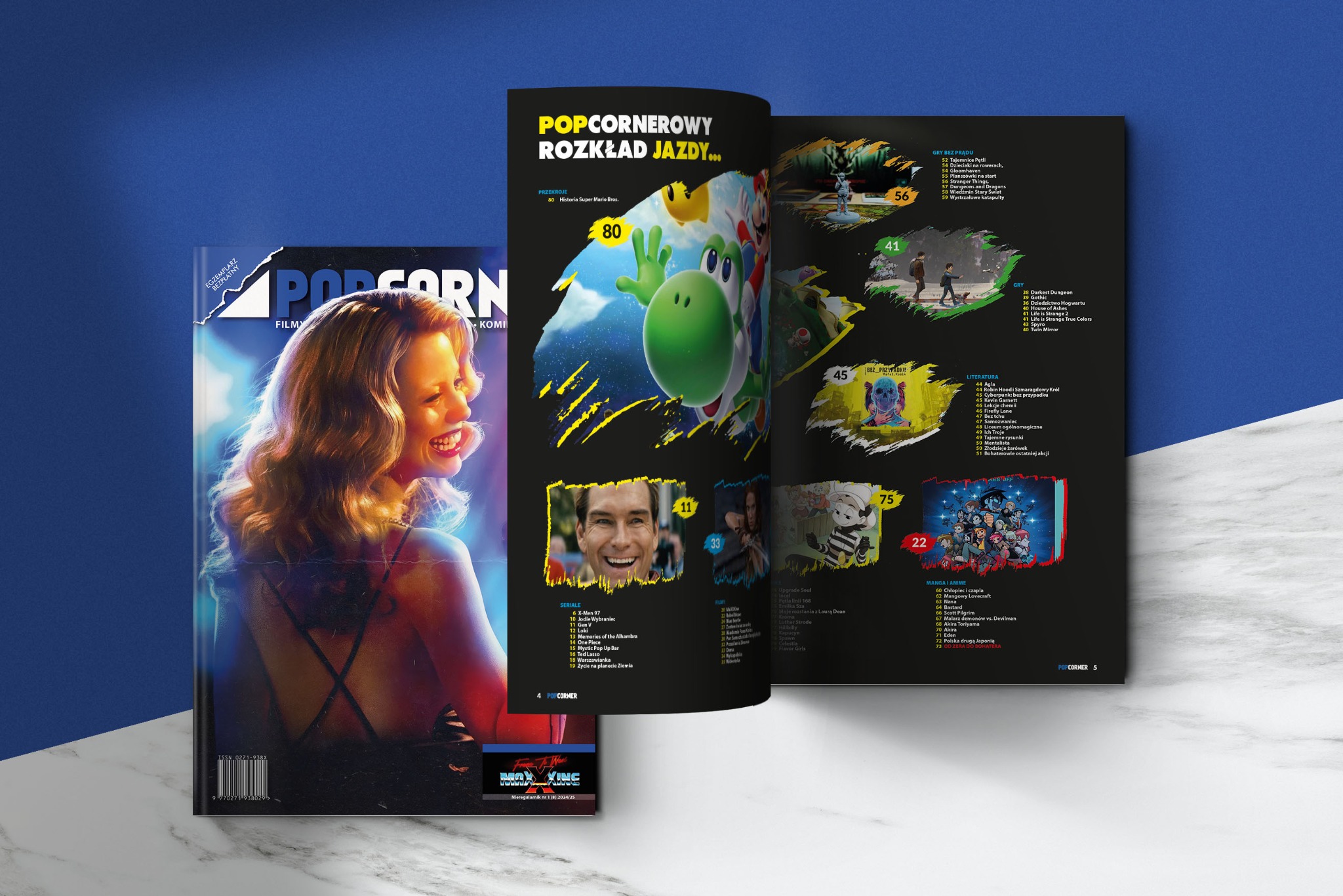 Okładka i rozkładówka magazynu POPCORNER z grafikami gier, seriali, filmów i komiksów, na marmurowym tle z niebieskim akcentem. Widoczny fragment twarzy kobiety.