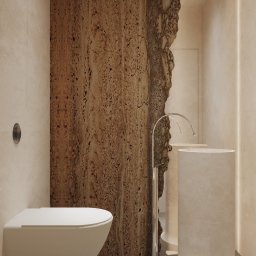 Miód Studio Weronika Babij - Nowoczesna łazienka z beżowymi ścianami, podwieszaną toaletą i umywalką na postumencie. Ciekawa faktura ściany z efektem naturalnego kamienia.