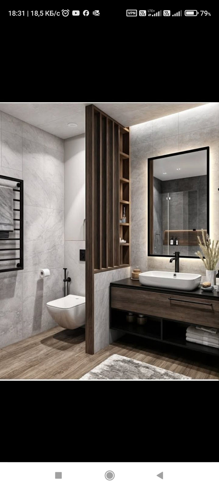 Nowoczesna łazienka z marmurowymi płytkami, drewnianą ścianką działową i podświetlanym lustrem, ukazująca minimalistyczny design i funkcjonalne rozwiązania.