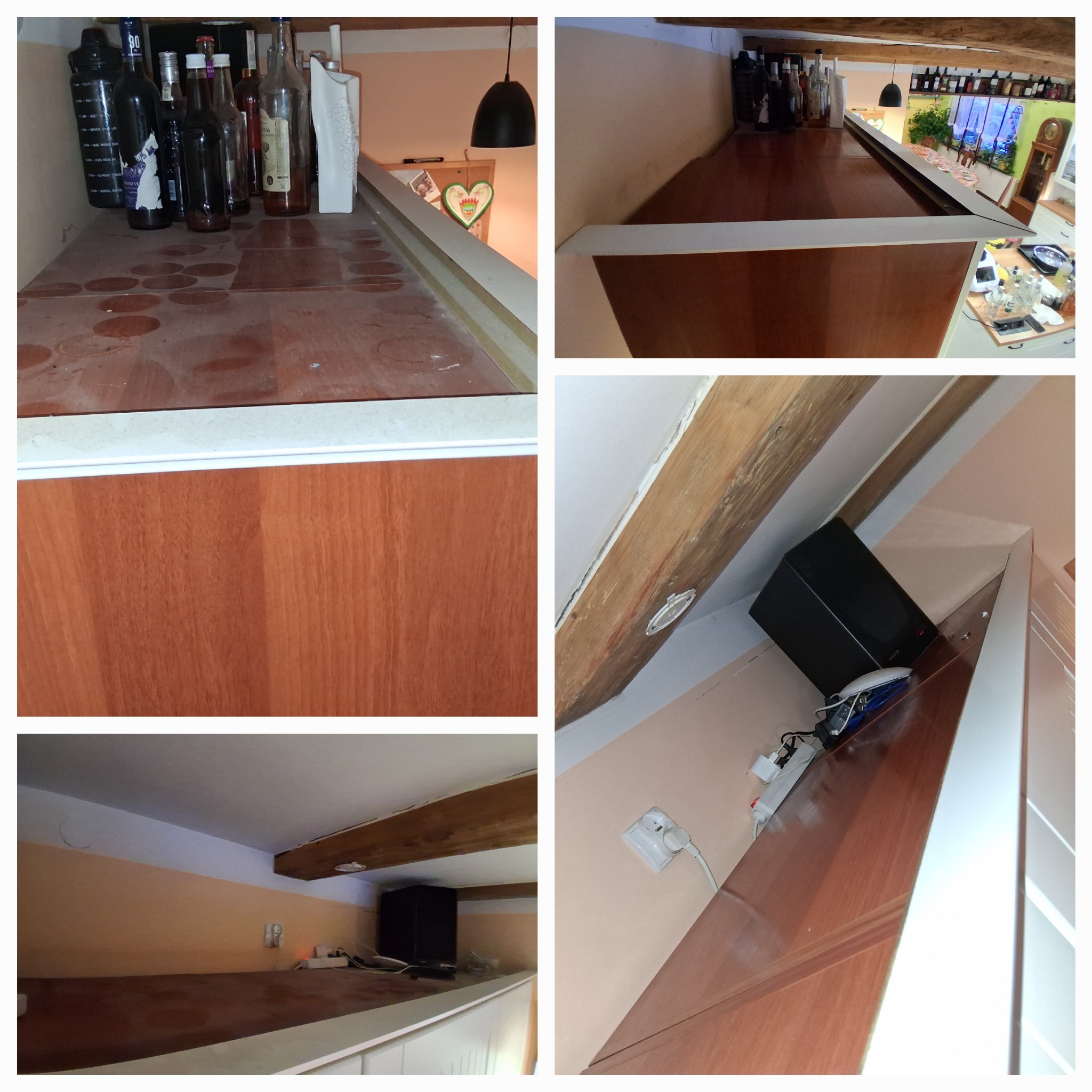 Brudny blat baru z plamami i butelkami w Mąkowarsku. Widoczne drewniane belki stropowe i gniazdka elektryczne. Wymaga sprzątania.