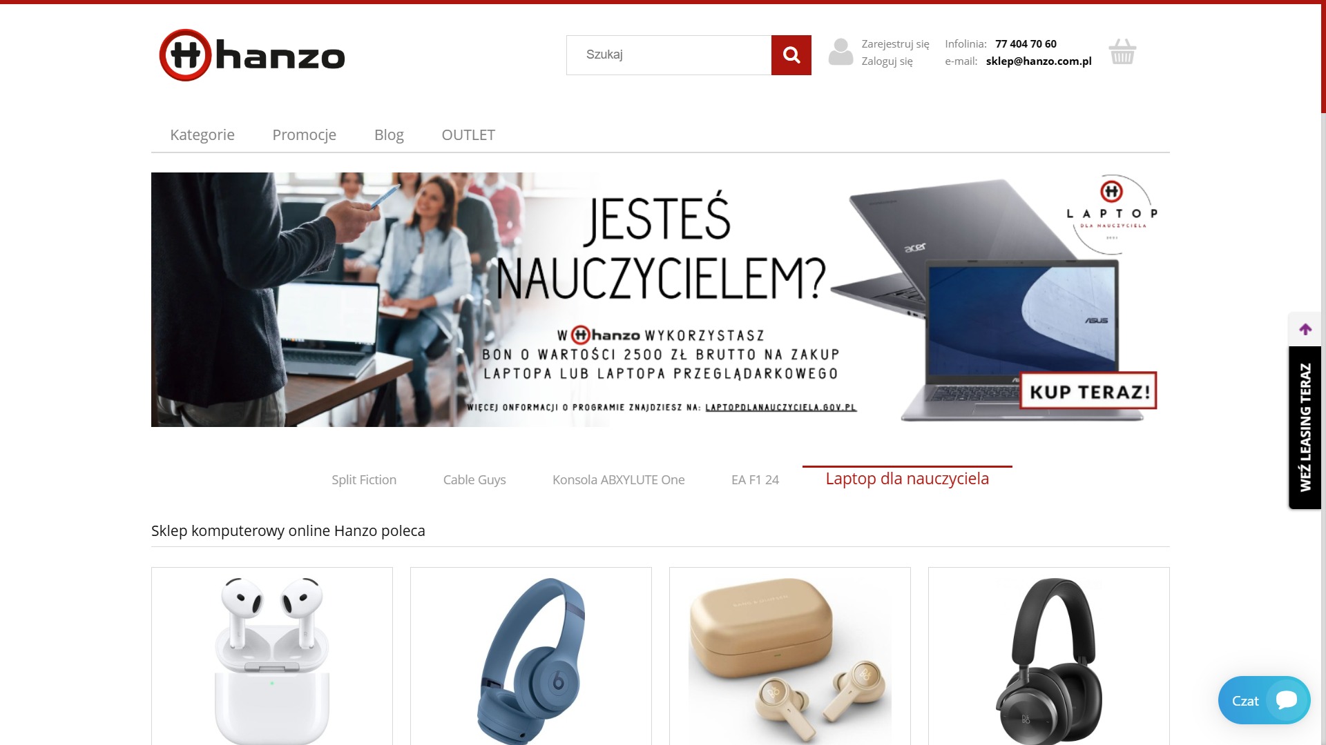 Strona internetowa sklepu Hanzo z promocją laptopów dla nauczycieli. Na banerze nauczyciel prezentuje laptopa grupie słuchaczy. Widoczne słuchawki bezprzewodowe.
