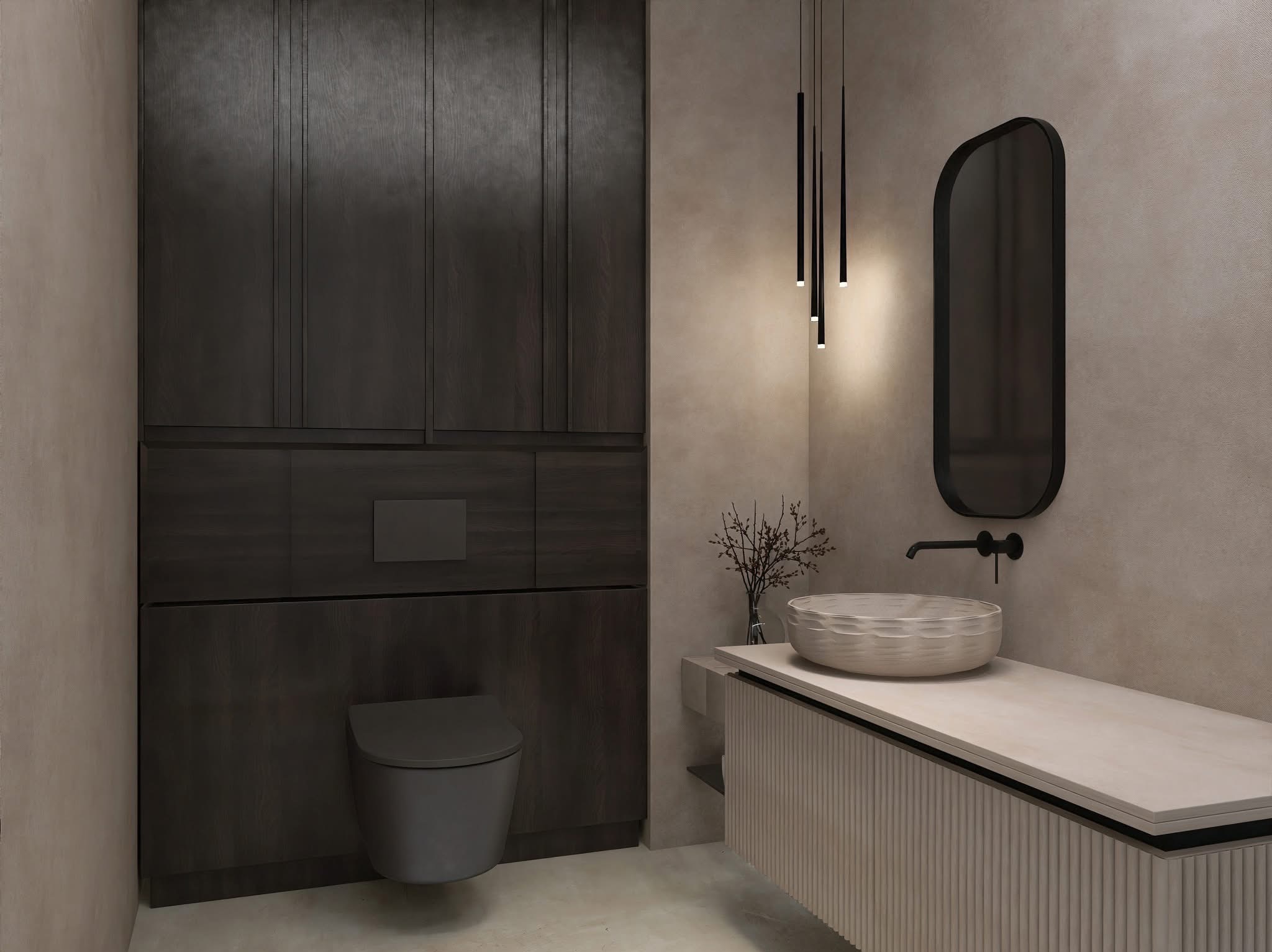 Nowoczesna łazienka w beżach i brązach: wisząca toaleta, umywalka nablatowa, podłużne lustro i minimalistyczne lampy wiszące.