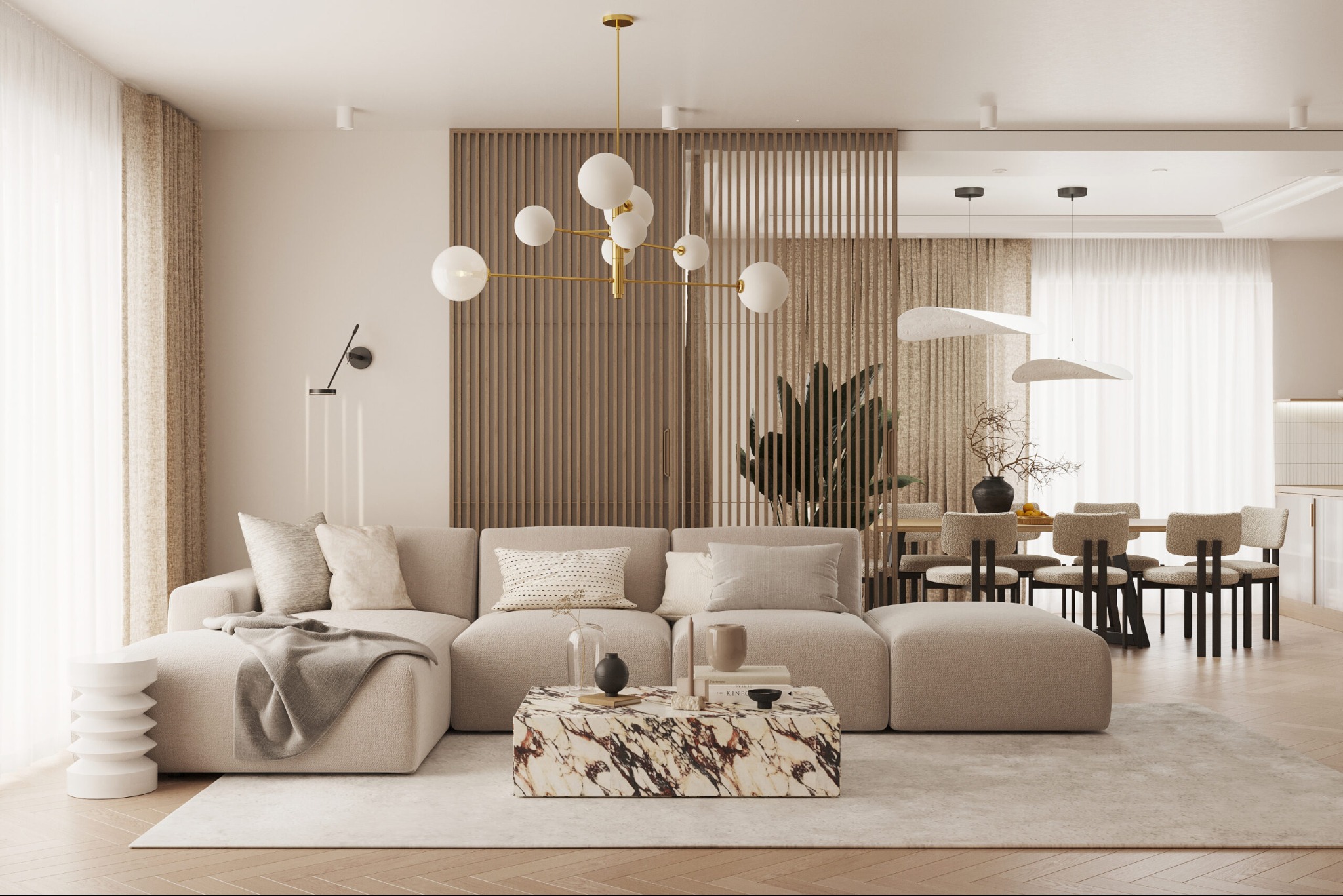 Jasny salon z beżową sofą modułową, marmurowym stolikiem kawowym i złotą lampą wiszącą. W tle jadalnia z drewnianym stołem i krzesłami. Całość w neutralnej kolorystyce.