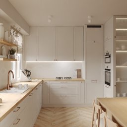 Pracownia Aranżacji Wnętrz O-Kreślarnia NATALIA OSIECKA-RUMIŃSKA - Jasna kuchnia w stylu skandynawskim: białe szafki z drewnianymi blatami, parkiet w jodełkę, miedziana armatura i oświetlenie punktowe. Minimalistyczny design.