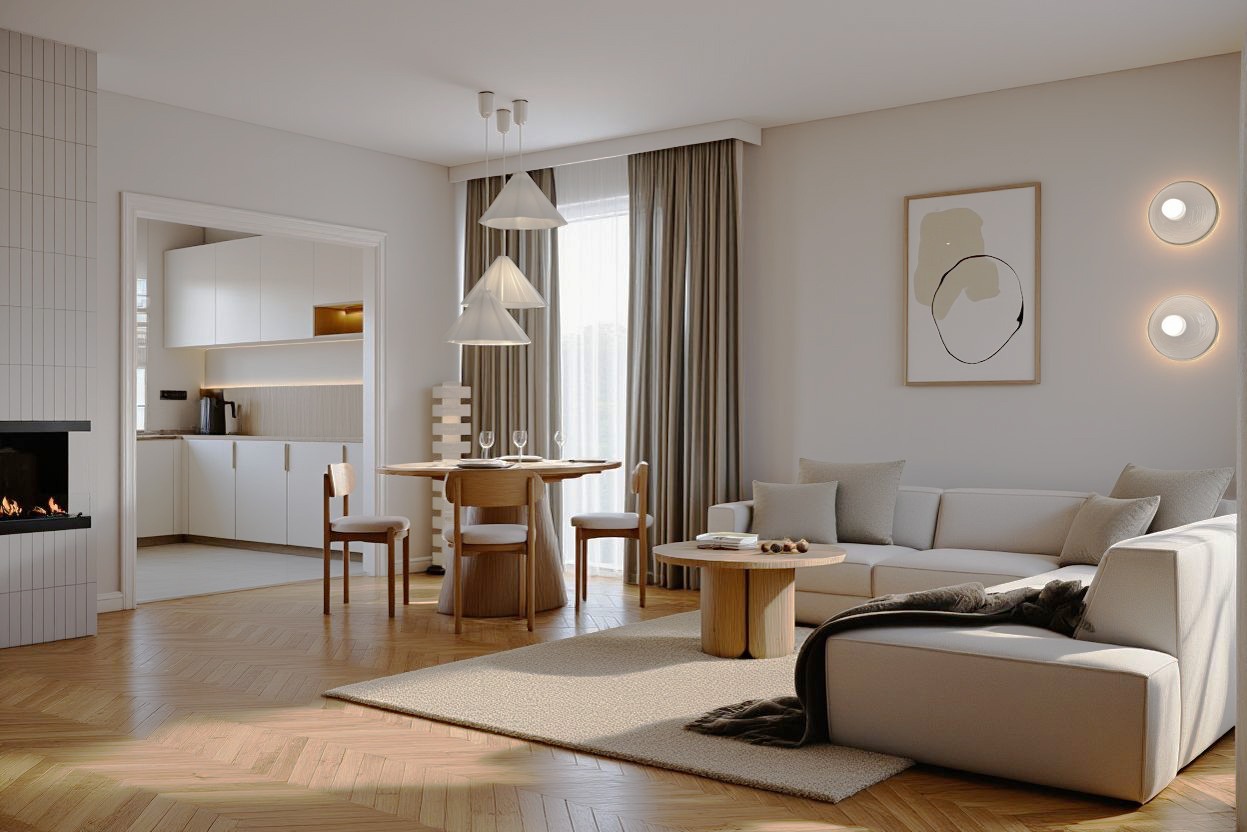 Jasne wnętrze: salon z jadalnią i widokiem na kuchnię. Parkiet w jodełkę, beżowa sofa, okrągły stół, trzy lampy wiszące. Minimalistyczny design z elementami drewna.