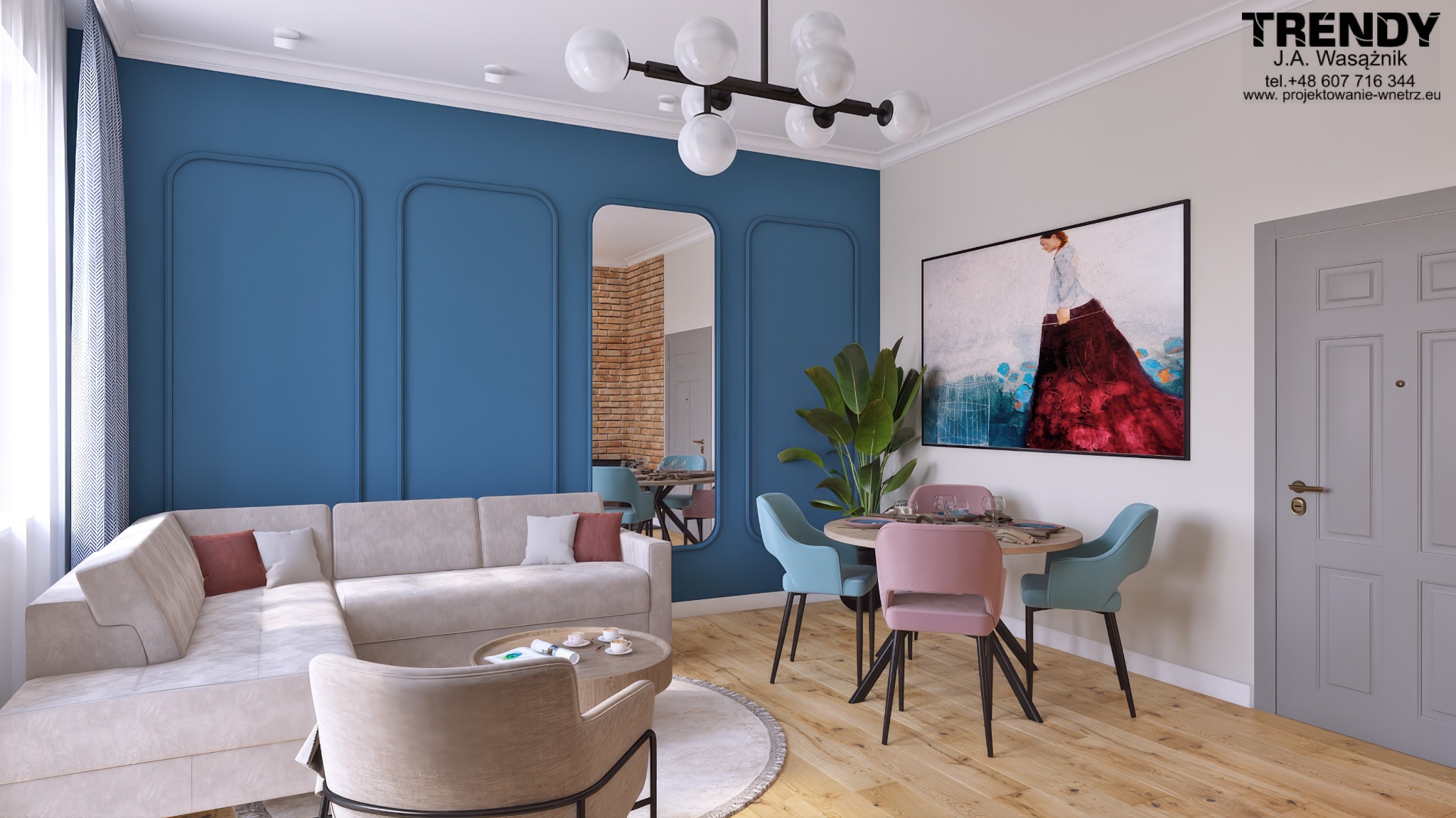 Stylowy salon z niebieską ścianą, beżową sofą narożną, okrągłym stołem jadalnym z pastelowymi krzesłami i lustrem odbijającym ceglaną ścianę. Nowoczesne oświetlenie.