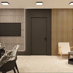 Stylowa aranżacja salonu z drewnianymi lamelami na ścianie, minimalistycznym stolikiem kawowym i transparentnymi krzesłami. Nowoczesne oświetlenie.