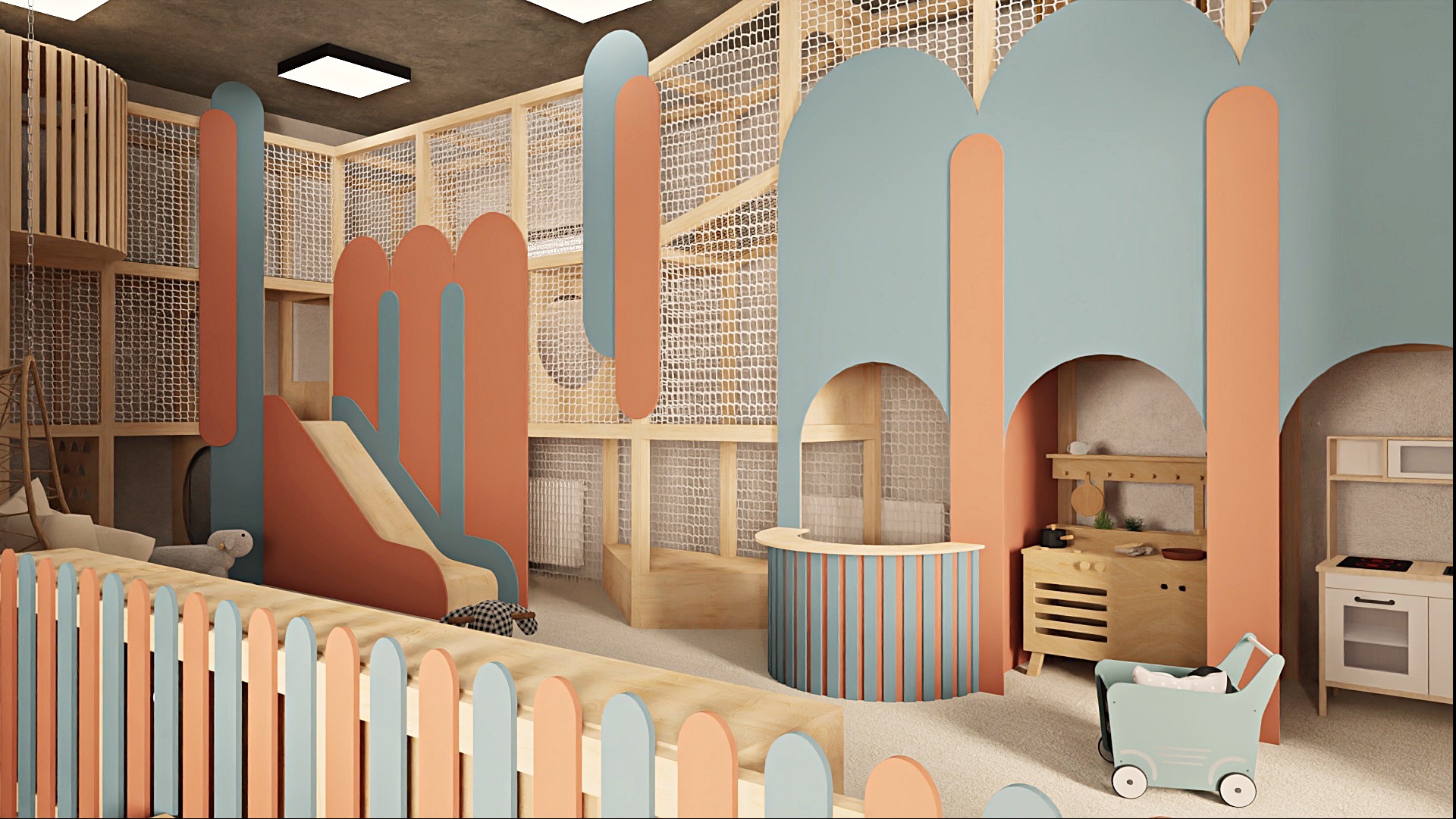 Pastelowa aranżacja sali zabaw z drewnianą konstrukcją, siatkami, zjeżdżalnią i zabawkami. Elementy w odcieniach pomarańczu i błękitu.