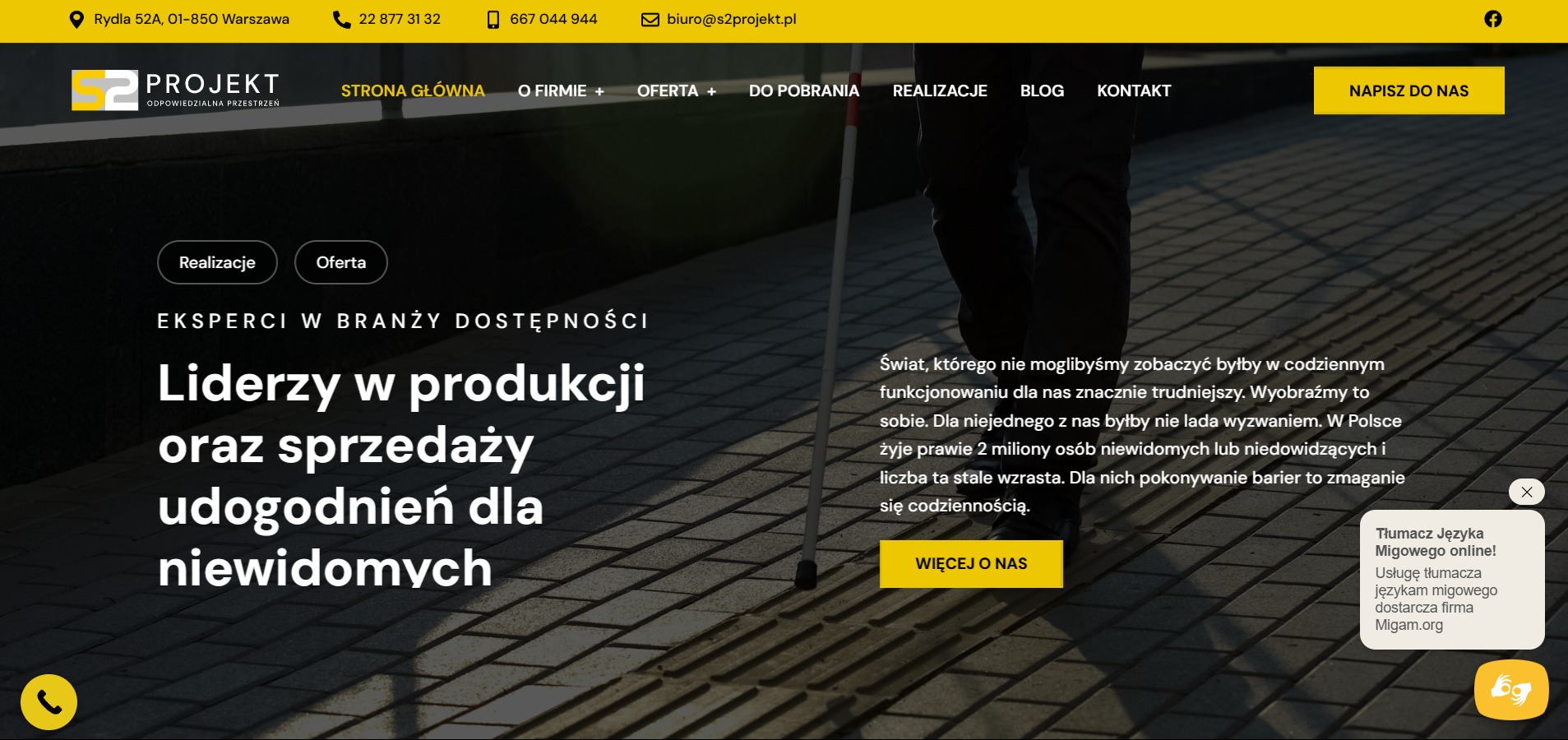 Strona internetowa firmy S2 Projekt, specjalizującej się w udogodnieniach dla osób niewidomych. Widoczny fragment chodnika z wypukłą fakturą i biała laska.