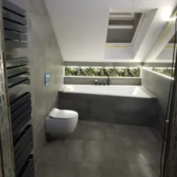 Nowoczesna łazienka na poddaszu z szarą glazurą, podświetlaną wanną, toaletą podwieszaną i grzejnikiem drabinkowym. Okno dachowe doświetla wnętrze.