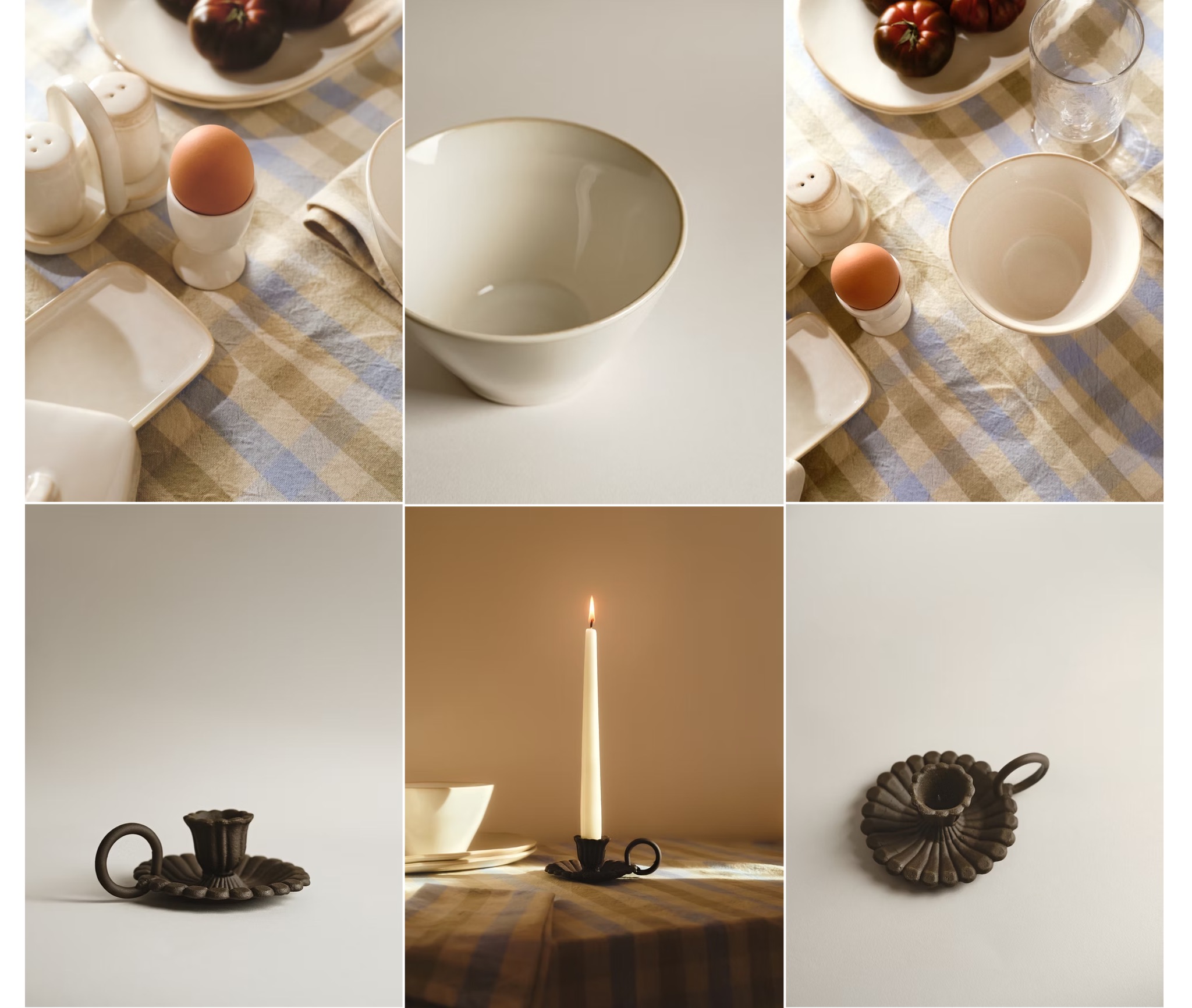 Kompozycja z jajkiem w kieliszku, solniczką, misą, talerzem z pomidorami i świecznikiem na stole z tkaniną w paski, w ciepłej tonacji.