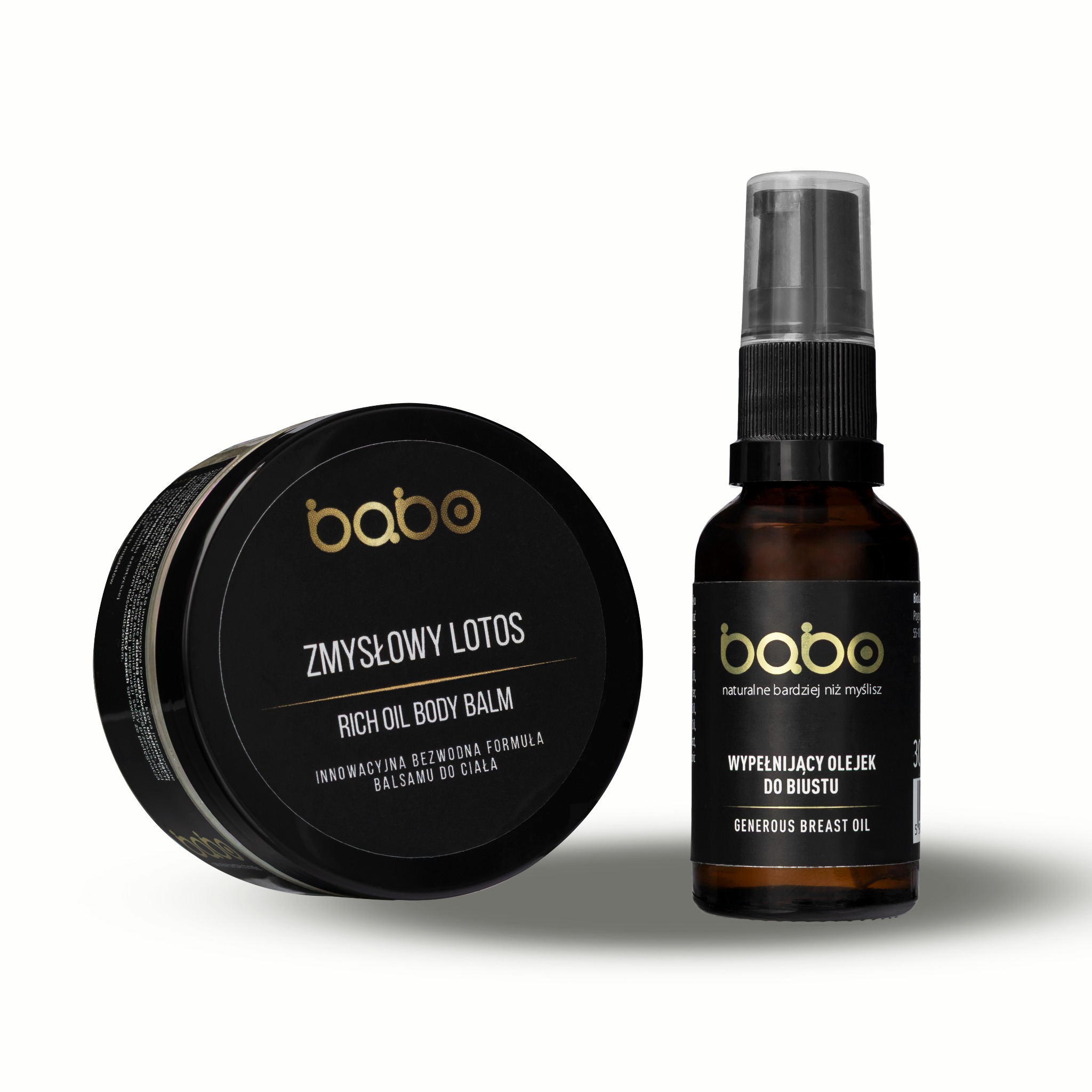 Zestaw kosmetyków Babo: balsam do ciała Zmysłowy Lotos i olejek do biustu. Eleganckie opakowania w czerni i złocie na neutralnym tle, podkreślone miękkim światłem.