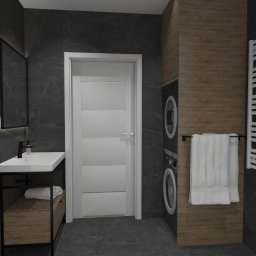 Sedno Przestrzeni Anna Sułot - Nowoczesna łazienka z umywalką na czarnym stelażu, pralką w zabudowie i grzejnikiem drabinkowym. Ciemne płytki imitujące kamień i drewniane akcenty.