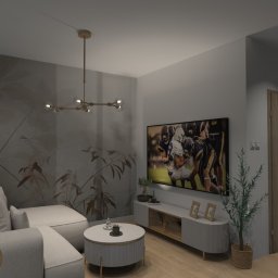 Sedno Przestrzeni Anna Sułot - Nowoczesny salon z narożnikiem, okrągłym stolikiem kawowym i ścianą z motywem roślinnym. Telewizor z dynamicznym obrazem i designerska lampa wisząca.