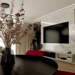 Eleganckie wnętrze salonu z okrągłym, czarnym stołem na pierwszym planie, marmurową ścianą i telewizorem w tle. Wazon z suchymi kwiatami dodaje aranżacji naturalnego charakteru.