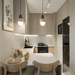 Niezabudka Design - Jasna kuchnia z drewnianymi akcentami: minimalistyczne szafki, białe płytki w jodełkę, owoce na blacie i designerskie lampy wiszące. Nowoczesne i przytulne wnętrze.