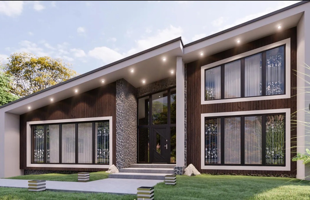 Nowoczesny dom jednorodzinny z brązową, drewnianą elewacją, kamiennymi akcentami i dużymi oknami. Widoczne schody wejściowe i zadbany trawnik. Dom z oświetleniem zewnętrznym.