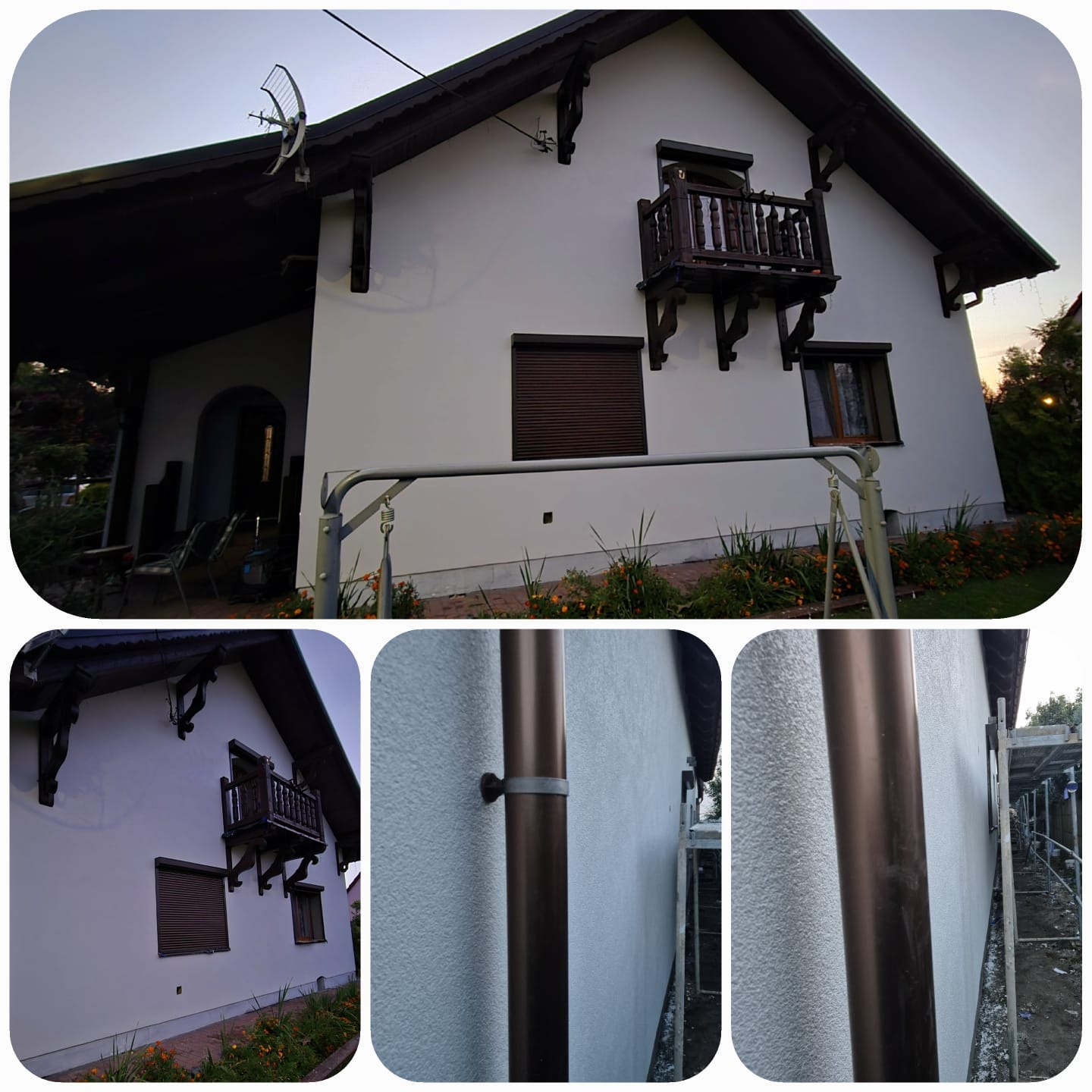 Biała elewacja domu z brązowymi elementami dekoracyjnymi i balkonem. Widoczne rynny i fragment rusztowania. Detal faktury tynku.