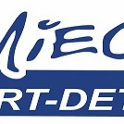 Logo firmy 'Kmiećik' z napisem 'Hurt-Detal' na niebieskim tle. Nazwa firmy pisana odręcznym stylem.