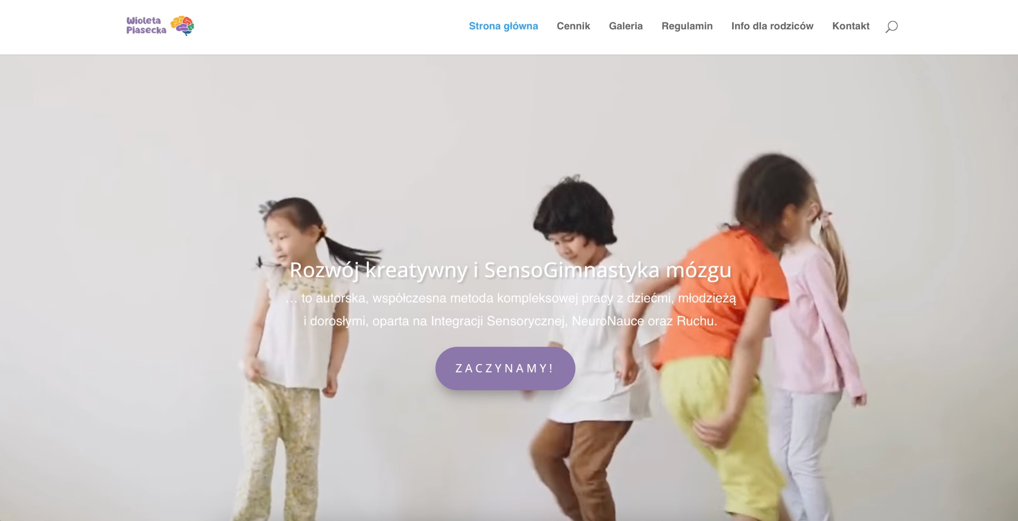 Strona internetowa wioletapiasecka.pl z logo i hasłem 'Rozwój kreatywny i SensoGimnastyka mózgu', prezentująca dzieci podczas zajęć sensorycznych.