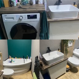 EMI Butik Kwiatowy Ewa Misiak - Nowoczesna łazienka po remoncie: biała wanna narożna, umywalka nablatowa z czarną armaturą, pralka Beko i drewnopodobne wykończenia.