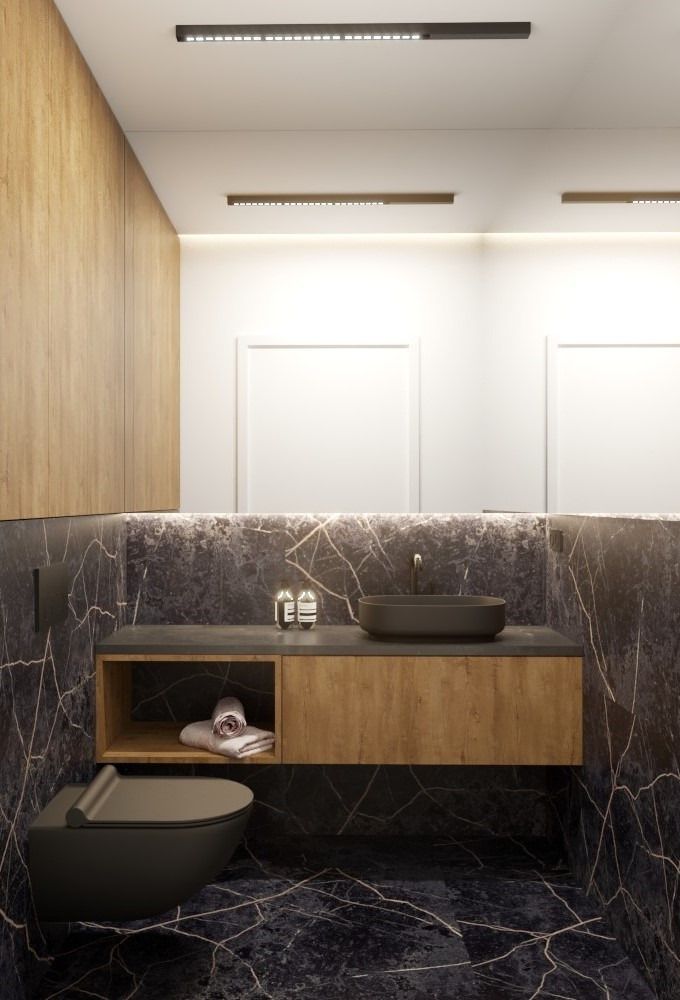 Nowoczesna łazienka z czarnym marmurem, drewnianą szafką pod umywalką i podwieszaną toaletą. Oświetlenie LED podkreśla elegancki design.