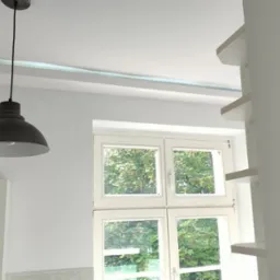 Jasne wnętrze po remoncie: białe ściany, okno z widokiem na zieleń, lampa w stylu loft i biały regał. Minimalistyczny design, czystość i świeżość.