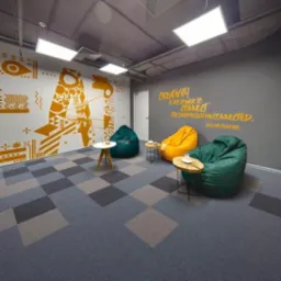 Wnętrze biura z wykładziną w szachownicę, pufami i cytatem na ścianie. Nietypowe, nowoczesne wykończenie podłogi w przestrzeni biurowej. Dekoracyjne malunki na ścianie.