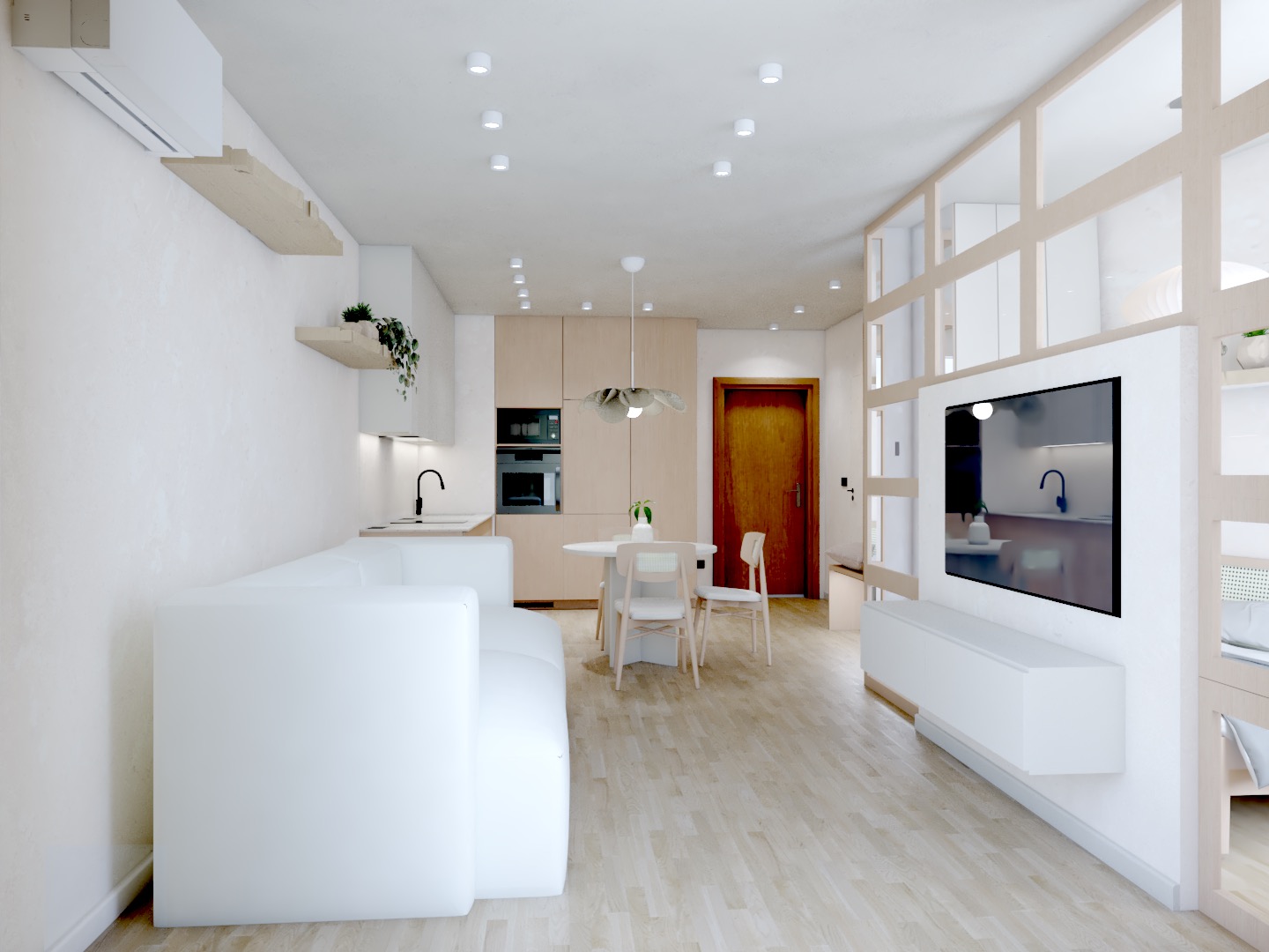 Jasne wnętrze mieszkania z aneksem kuchennym, białym narożnikiem i drewnianą podłogą. Widoczny stół z krzesłami i minimalistyczna zabudowa TV z przeszklonymi elementami.